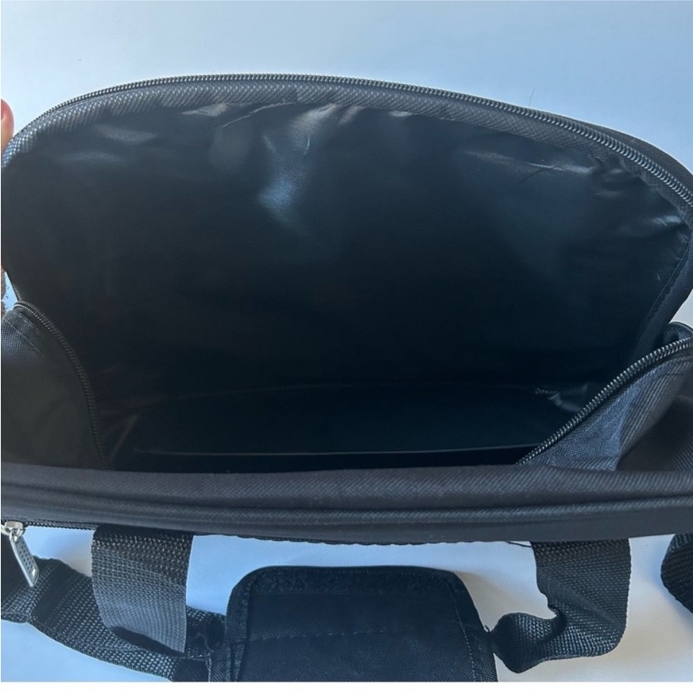 Black Travel Bag with Durable Fabric and Sleek Design - Picture 5 of 6